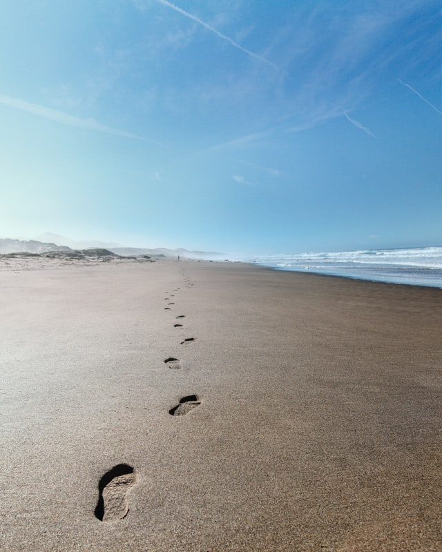 footsteps a long a beach