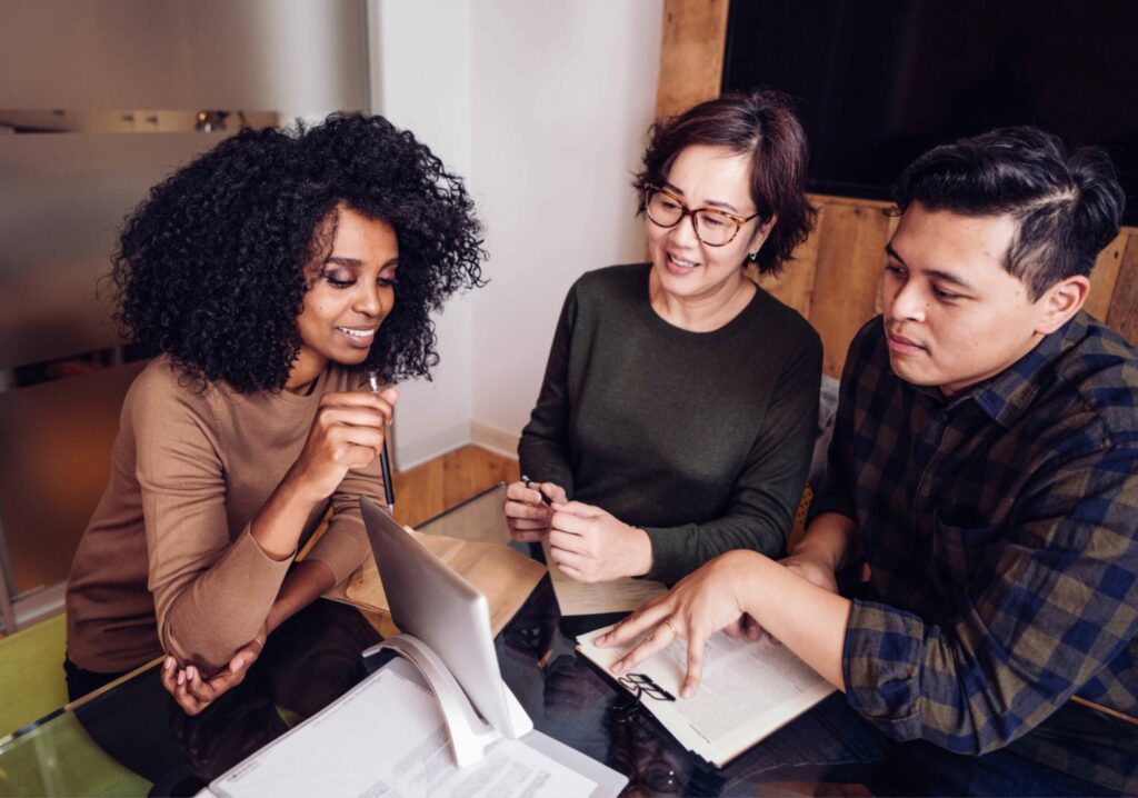 A broker meeting with her clients